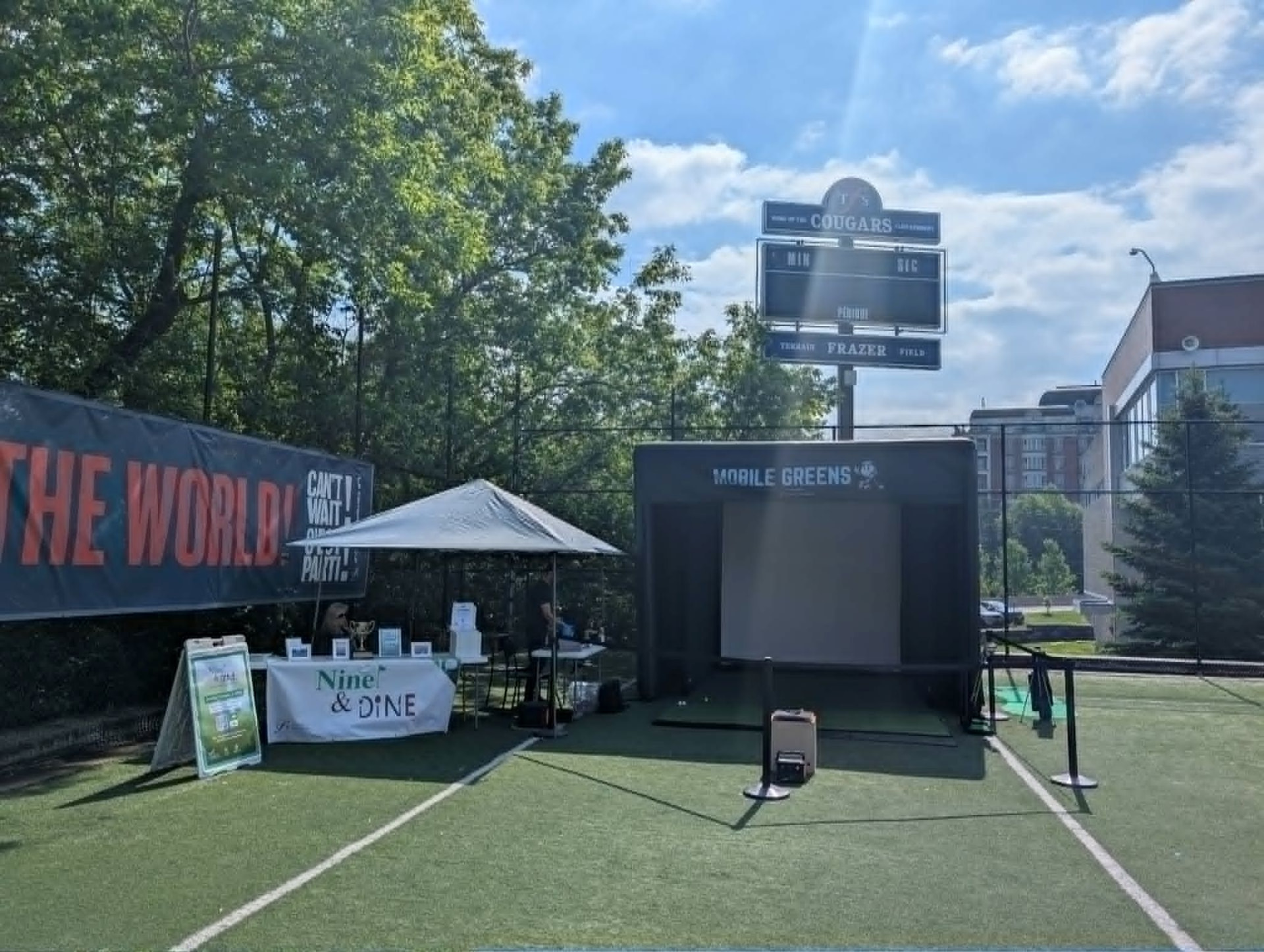Outdoor Mobile Greens simulator activation on an artificial turf field